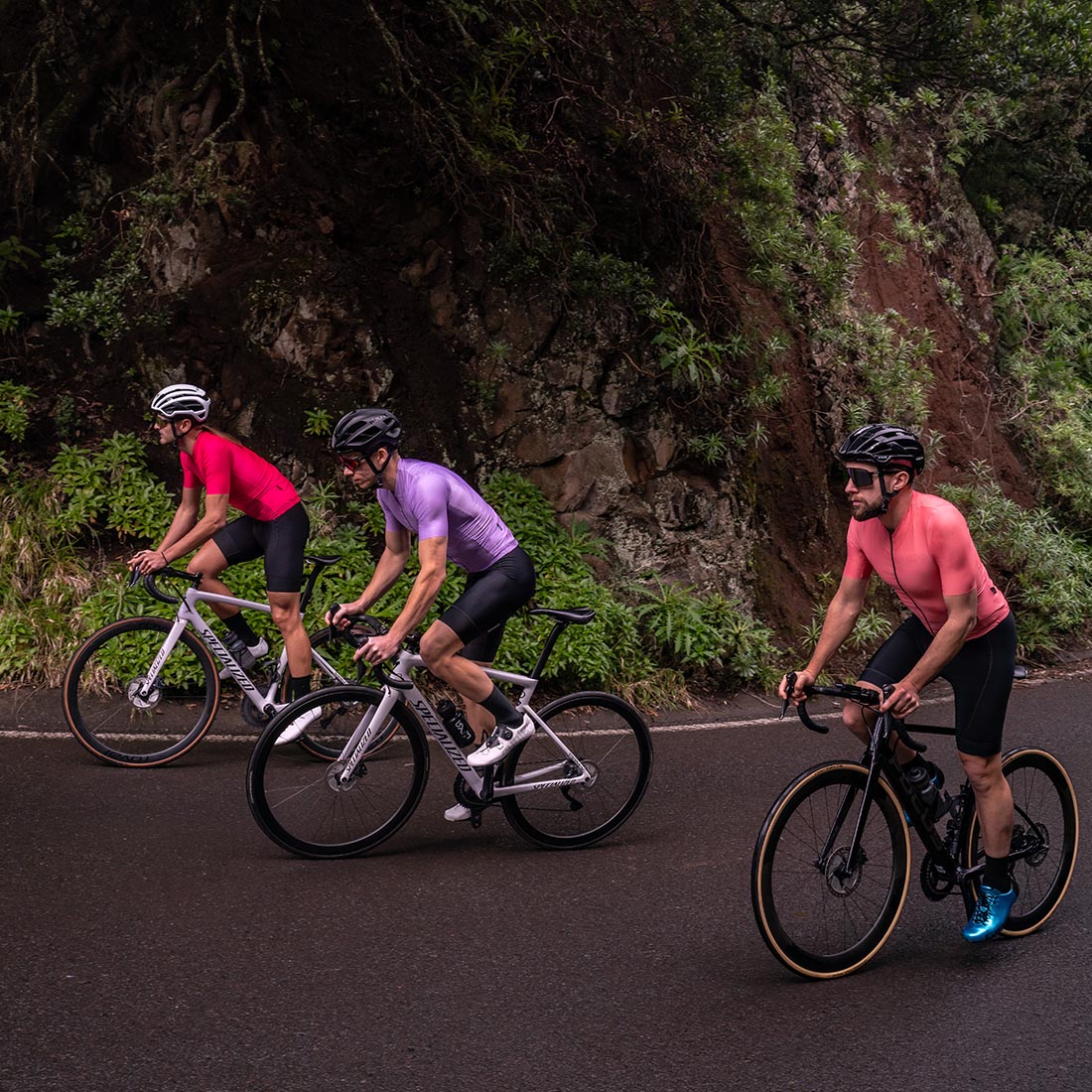bunch of 3 cyclists in Anaga Park on Tenerife wearing Luxa Jerseys (magenta, lilac, coral)